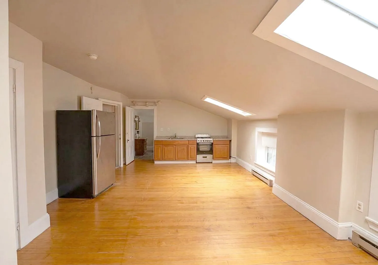 Top-Floor 2-Bedroom Oasis | Heat, Hot Water, Parking & Laundry in the West End! — Photo 1