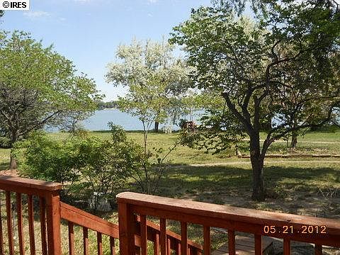 deck looking over the large yard to the lake