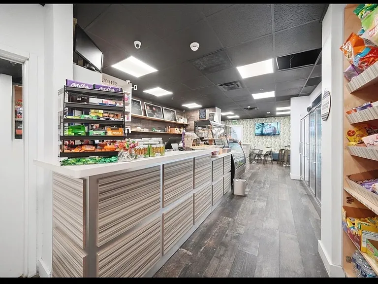 Luxury building's amenities: CAFE & MARKET, great for a croissant or an empanada & a cafecito on your way to work