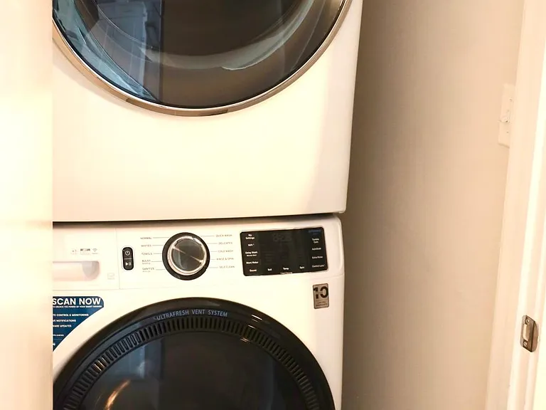 Full size washer and dryer inside of condo