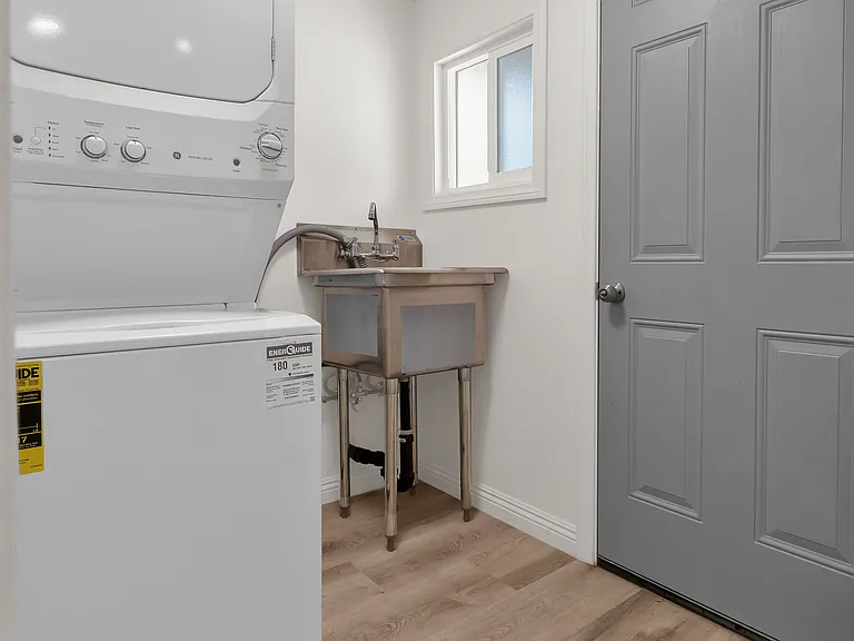Laundry room with utility sink.