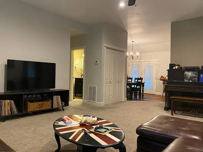 Family room, view to dining room and main bathroom. Bedroom 1 is to the left of bathroom