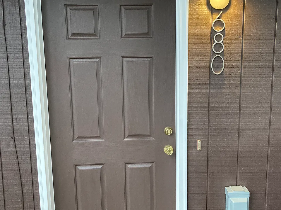 Front door, Level 2 EV charger on righthand side.