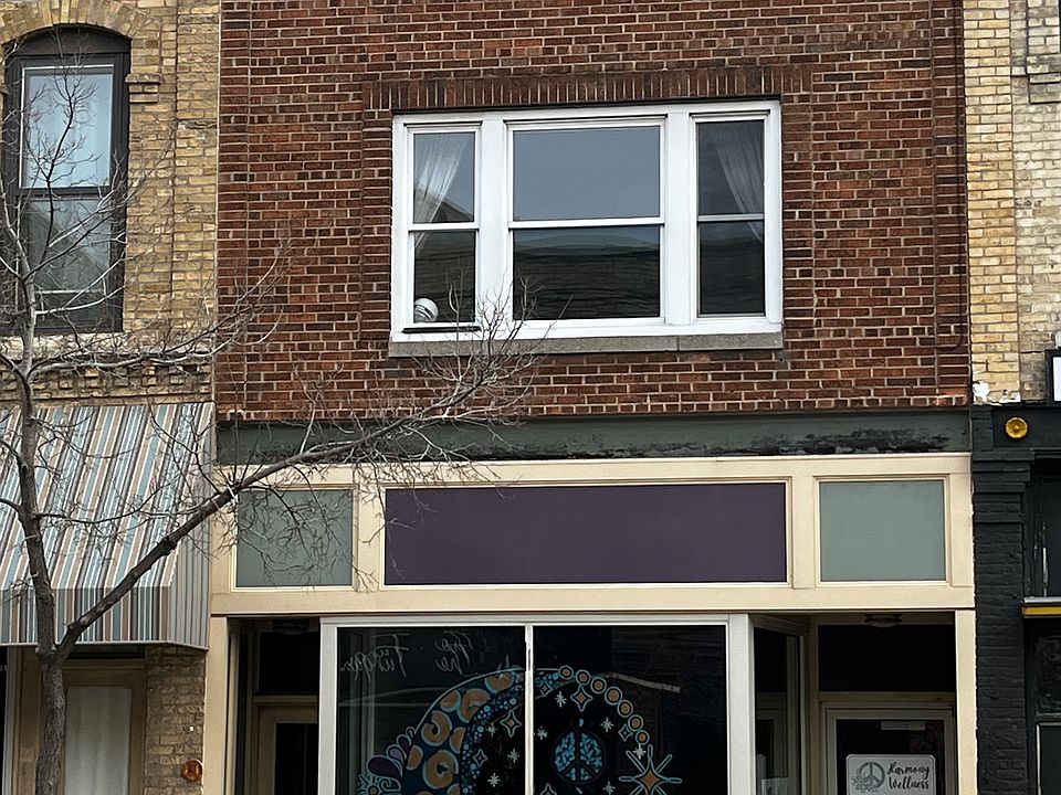 The apartment is located above the wellness center. The window on the 2nd floor is the living room window, looking on to Main St.
