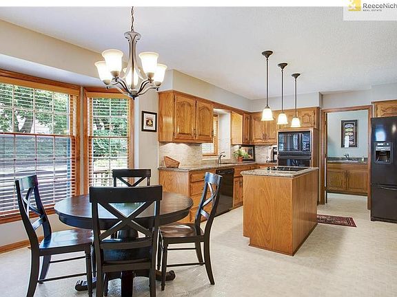 Wider view of the kitchen looking in from the family room.