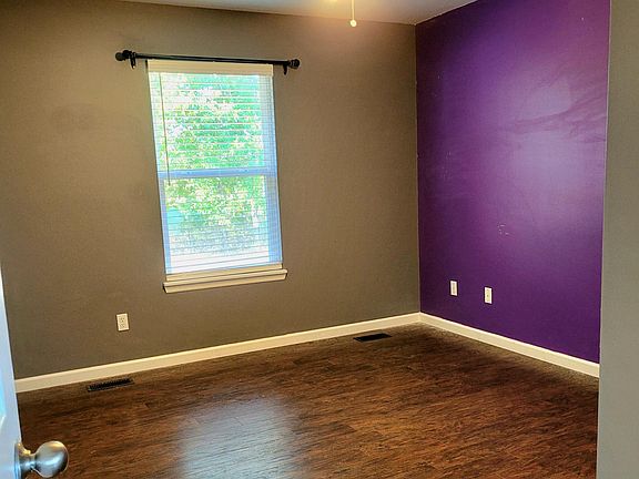Master bedroom. Purple wall will be painted to match unless requested by renter to keep it purple.