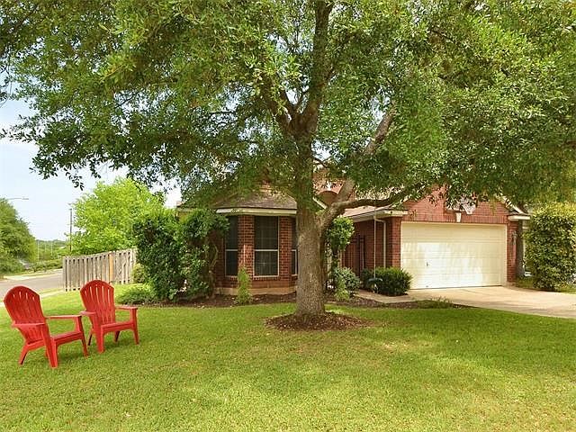 Flat, corner lot with a mature oak tree (with a swing!) adjacent to a cul-de-sac. New roof in 2012.