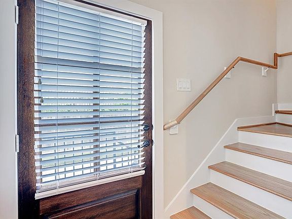 Blinds are installed on the first door to allow privacy.