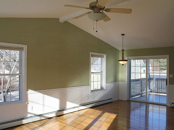 Living room & dining area, sliding door to upper deck.