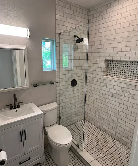 Bathroom with floor to ceiling italian marble, two medicine cabinets