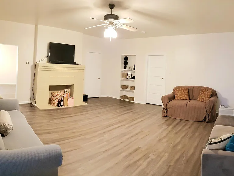 Living room with lots of space (fire place is not operable).