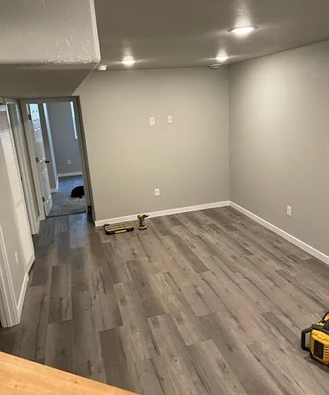Basement Family Room or Exercise room with TV Power already set up for wall mounting.