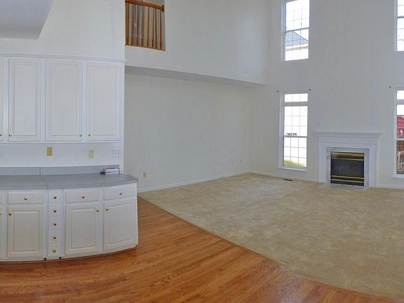 Kitchen area looking into the 2 story family room
