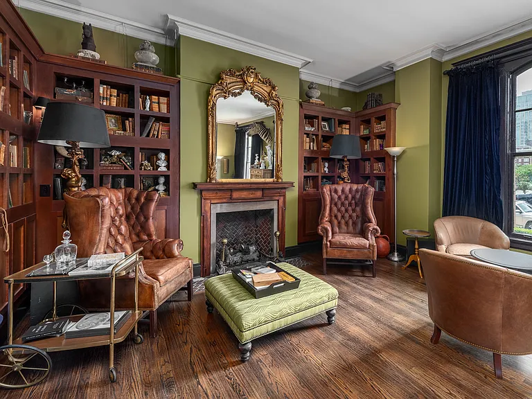 York House distinguished Library Bar with wingback leather arm chairs and gas fireplace