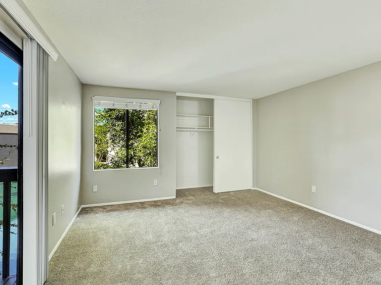 Lake Dianne Apartment Homes Two Bedroom living room and sliding glass doors.