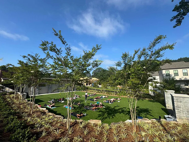 Community green space where events are organized (pictured, Yoga)