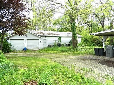 2 car detached garage. Look at how large the extension is off of garage - all workshop and storage!