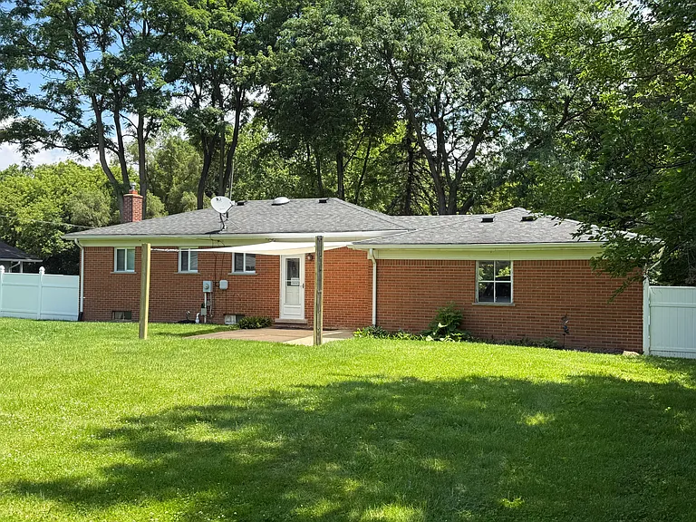 Rear Fenced Yard with Sun Shade