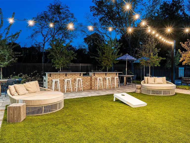 Outdoor Lounge with Grilling Area and Yard Games