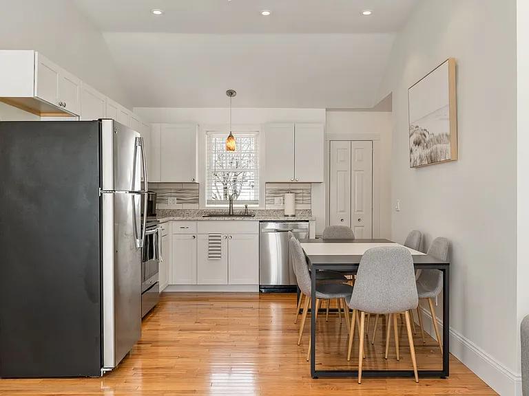 Eat-in Kitchen, Hardwood Floors, Stainless Steel Appliances, White Cabinetry, Granite Countertops, Recessed Lighting, Vaulted Ceiling, Open Floor Plan.
