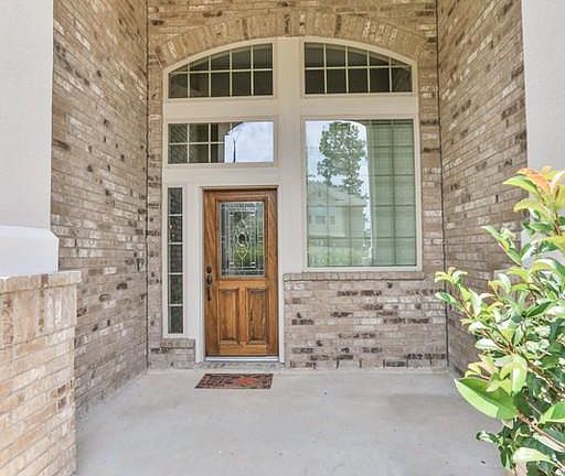 Beautiful gardens escort you to front porch