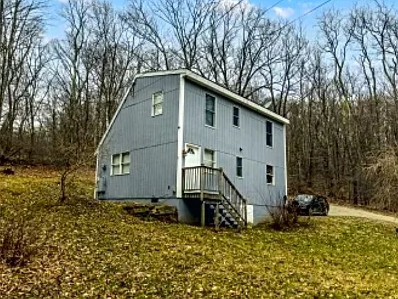 view from driveway entrance featuring second entrance
