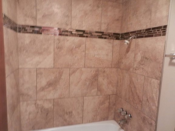 NEW bathroom tile surround with glass tile accent