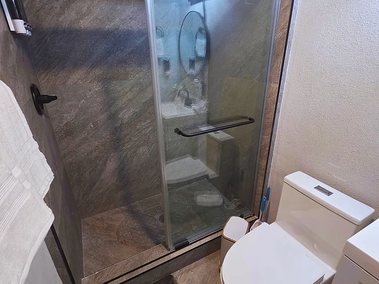 Modern glass-enclosed shower with stylish tile design for a spa-like feel.