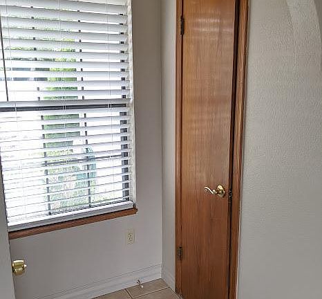 Well lit entry way with coat closet