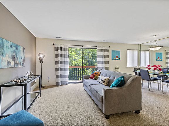 Open Living Room with natural light at Franklin River Apartments in Southfield, MI