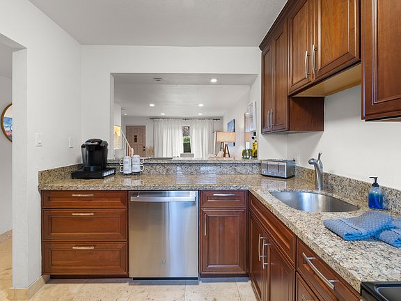 full kitchen includes all the utensils, toasters, refrigerator, dishwasher, microwave, lots of cabinet space