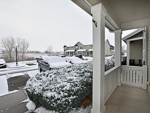 Front porch and ample parking in front of unit