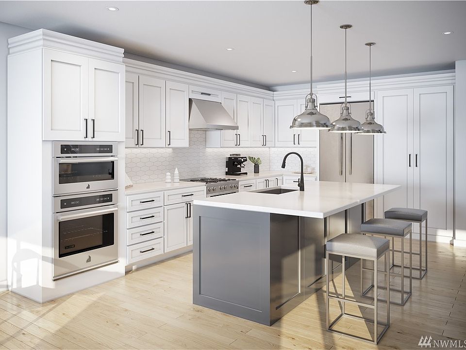 The Wilburton - Three bedrooms, 2.5 baths. Gourmet Kitchen with large center island. Photo not of actual home and may show some personalized features.
