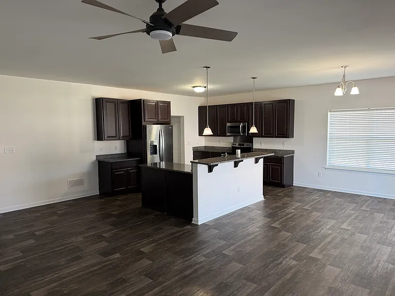 Open floor plan great room. Kitchen/dining/living