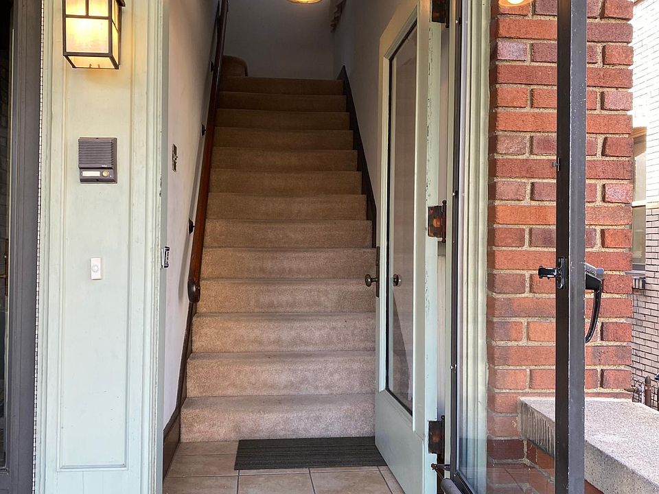 Front entry and steps leading to 2nd floor apartment