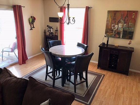 Bright Dining Room with Access to Balcony facing woods