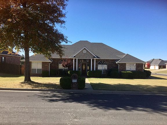 2 mature oak trees in front