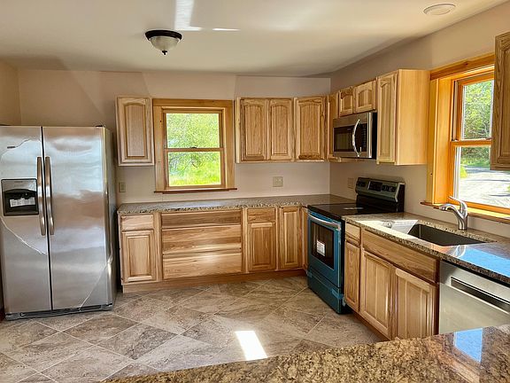 Kitchen with granite top counters and stainless steel appliances