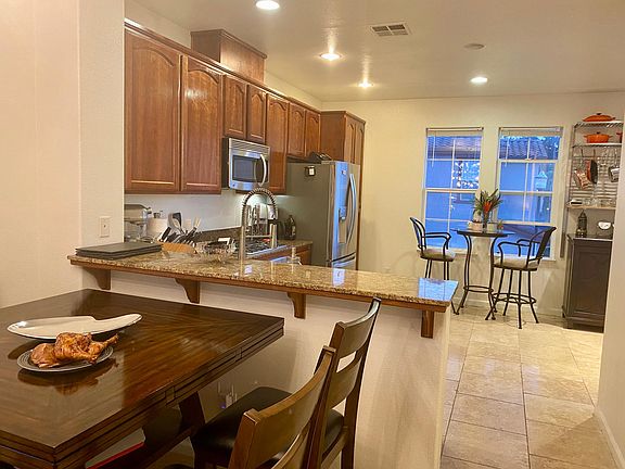 Updated kitchen with travertine floor