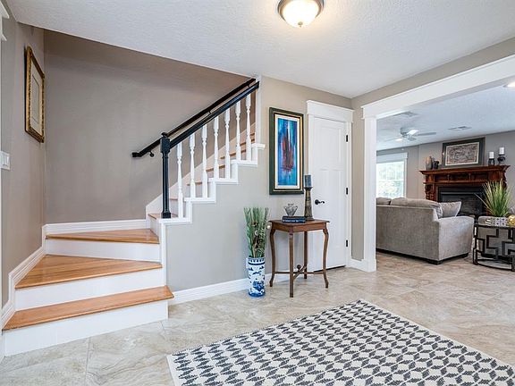 Welcome inside the entry, make yourself at home and stay awhile. The living room will be straight ahead and the formal dining is to your right. Both rooms have tons of natural lighting coming in as you enter this beautiful home. Look at the beautiful