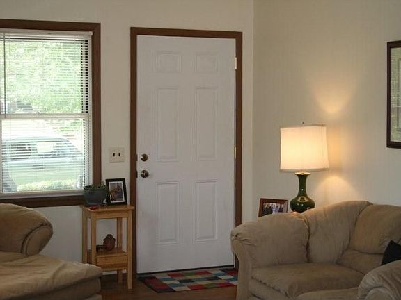 Living room with hardwood floors and plenty of natural light