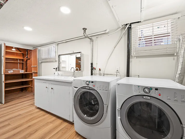 Laundry room with sink and tons of storage space