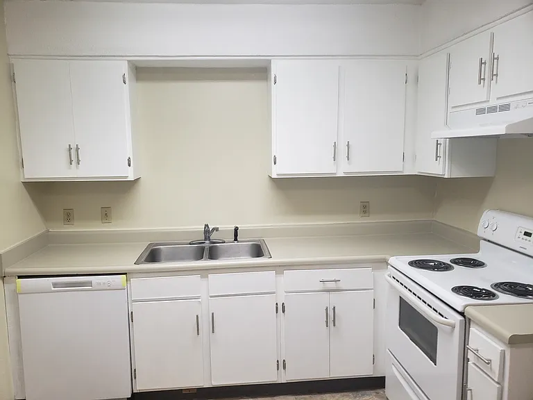 Kitchen with refurbished cabinets and counter tops