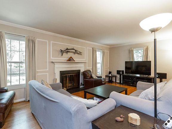 Large living room with wood-burning fireplace