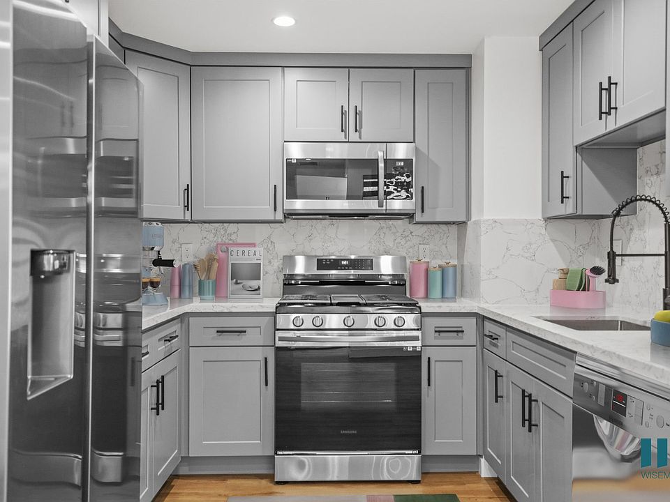 Kitchen with Stainless-Steel Refrigerator, Stove, Microwave Oven, and Dishwasher