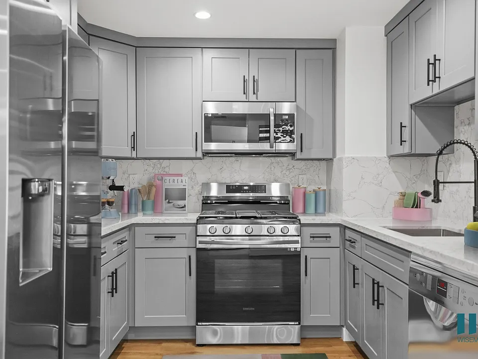 Kitchen with Stainless-Steel Refrigerator, Stove, Microwave Oven, and Dishwasher