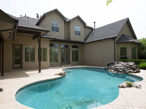Additional view of Lagoon Pool reveals French doors to Great Room and Breakfast Nook, making snack a
