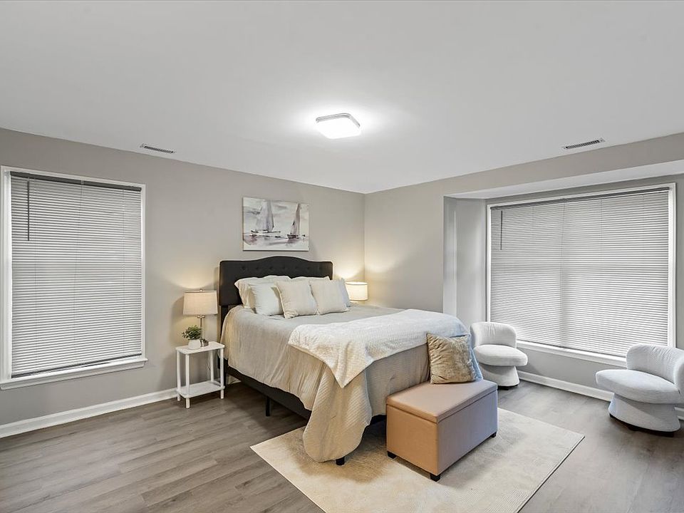 Primary bedroom with ensuite primary bathroom