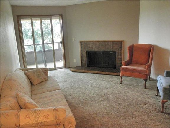 Cozy living room, fully carpeted with wood burning fireplace. Freshly painted.