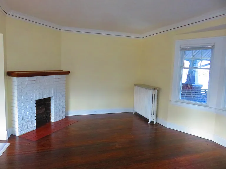decorative fireplace in living room--notice the "picture moulding" in the living and dining rooms